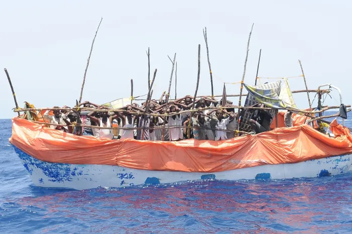 Framed Print : Primitive boat crowded with suspected pirates under arrest and awaiting a U.S. Navy boarding party in the Gulf of Aden Framed Print : Primitive boat crowded with suspected pirates under arrest and awaiting a U.S. Navy boarding party in the Gulf of Aden
