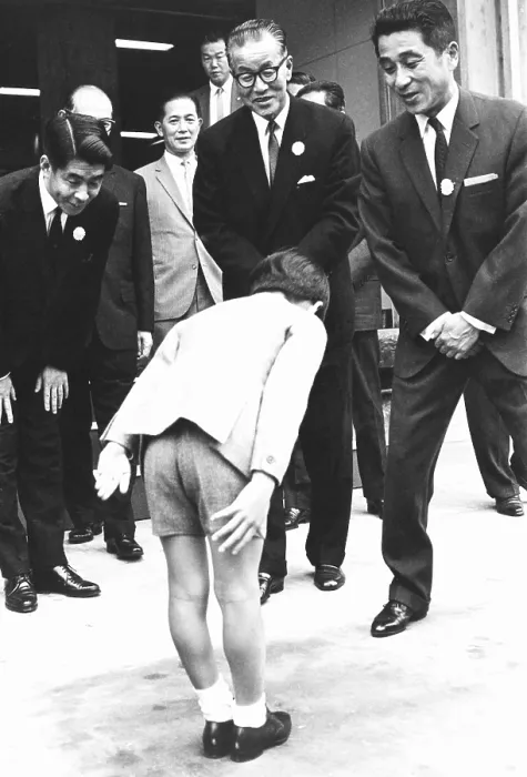 Framed Print : Prince Hiro bows before Orie Kitajima (center), President of the Dainippon Printing Company. Oct. 11, 1967 Framed Print : Prince Hiro bows before Orie Kitajima (center), President of the Dainippon Printing Company. Oct. 11, 1967