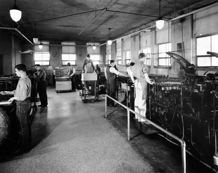 Framed Print : Printing is one of the trades taught Boys Town citizens. Boys are shown here putting out their semi-monthly issue of the Boys Town Times. 1944