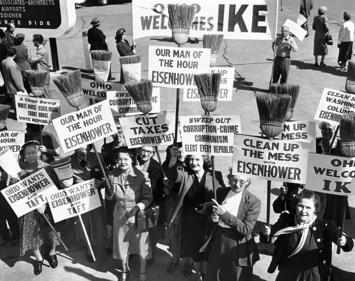 Framed Print : Pro-Eisenhower demonstrators with posters on household brooms