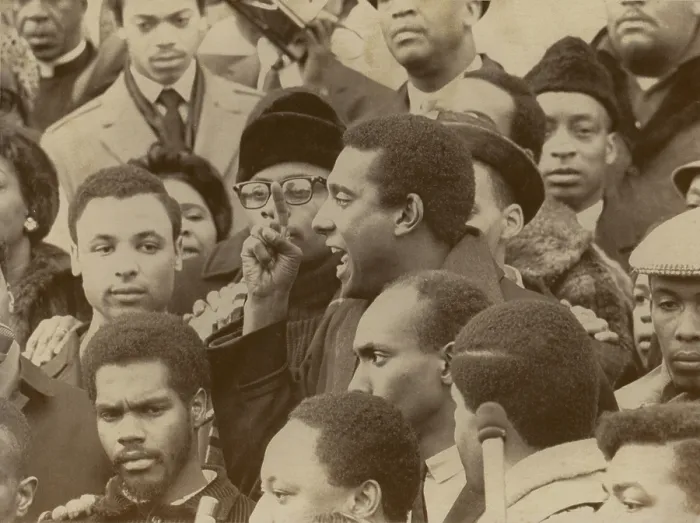 Framed Print : Profile of Stokely Carmichael speaking and gesturing in midst of crowd demonstrating near the Capitol in Washington, DC. January 10, 1967
