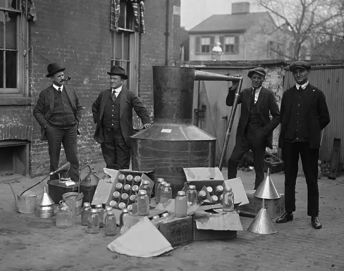 Framed Print : Prohibition agents stand with a still and mason jars used to distill hard liquor in Wash. D.C. area. Nov. 11, 1922 (BSLOC_2016_8_70) Framed Print : Prohibition agents stand with a still and mason jars used to distill hard liquor in Wash. D.C. area. Nov. 11, 1922 (BSLOC_2016_8_70)
