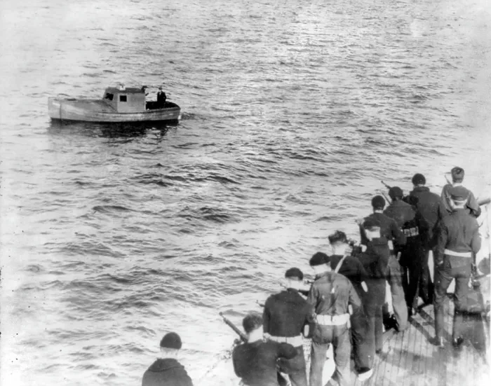 Framed Print : Prohibition, Coast Guardsmen with rifles along deck facing a small boat