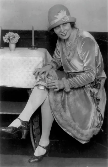 Framed Print : Prohibition, Miss Rhea seated with flask in garter on leg, original caption: Latest thing in flasks, Mlle
