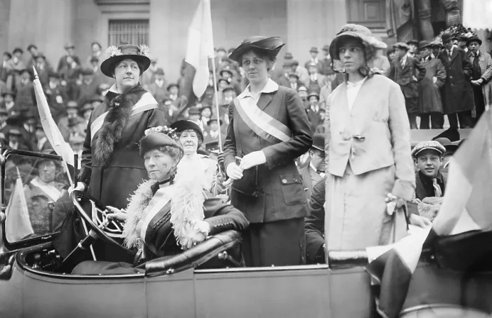 Framed Print : Prominent woman's suffrage advocates parade in an open car supporting the ratification of the 19th amendment granting women the right to vote in federal elections