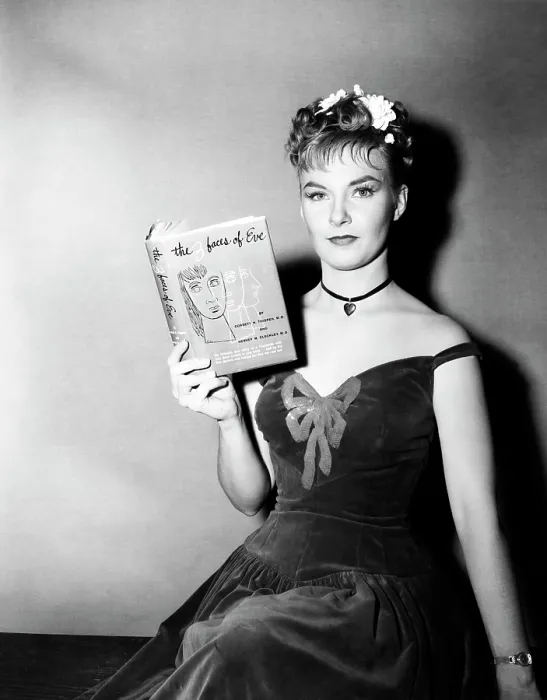 Framed Print : Publicity shot of star JOANNE WOODWARD holding a copy of the bestseller, THE THREE FACES OF EVE, 1957, TM and Copyright (c) 20th Century-Fox Film Corp. All Rights Reserved