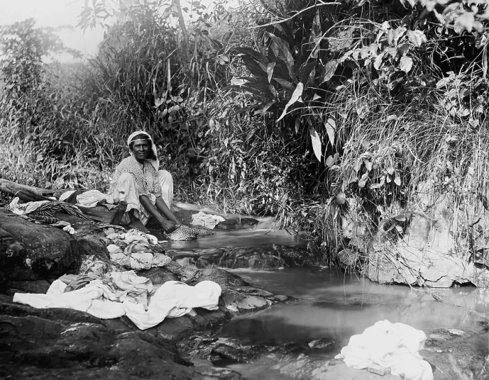 Framed Print : Puerto Ricans women washing laundry in an open stream shortly after Puerto Rico was annexed by the United States after the Spanish American war. Ca. 1903