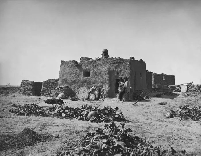 Framed Print : Pumpkins grow in front of a single-family Zuni adobe, 1879, photo by John K. Hillers