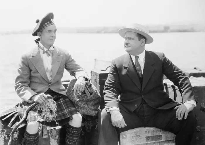 Framed Print : PUTTING PANTS ON PHILIP, from left: Stan Laurel, Oliver Hardy, 1927