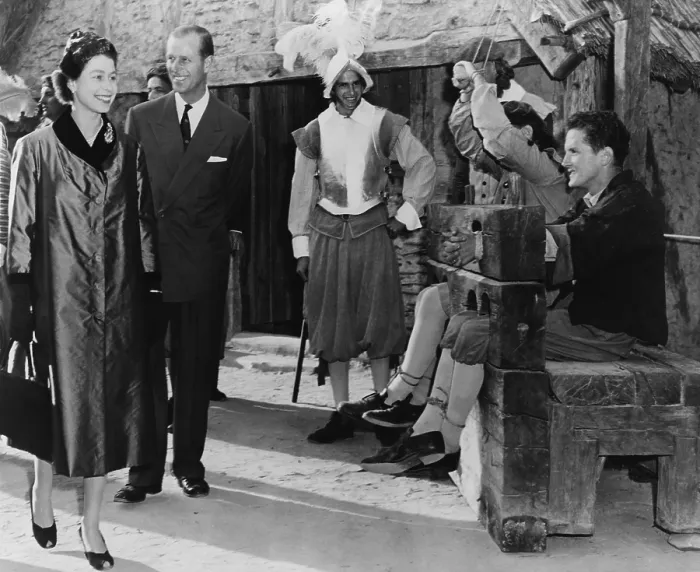 Framed Print : Queen Elizabeth II and Prince Philip are amused by two prisoners in stocks at Jamestown Framed Print : Queen Elizabeth II and Prince Philip are amused by two prisoners in stocks at Jamestown