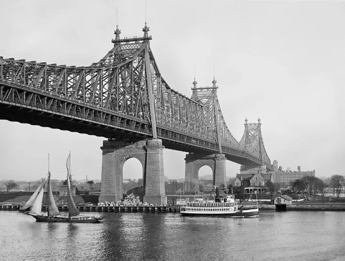 Framed Print : Queensboro Bridge straddling Blackwell's Island c. 1915. It is a double-decker cantilevered bridge with four piers of metal construction Framed Print : Queensboro Bridge straddling Blackwell's Island c. 1915. It is a double-decker cantilevered bridge with four piers of metal construction