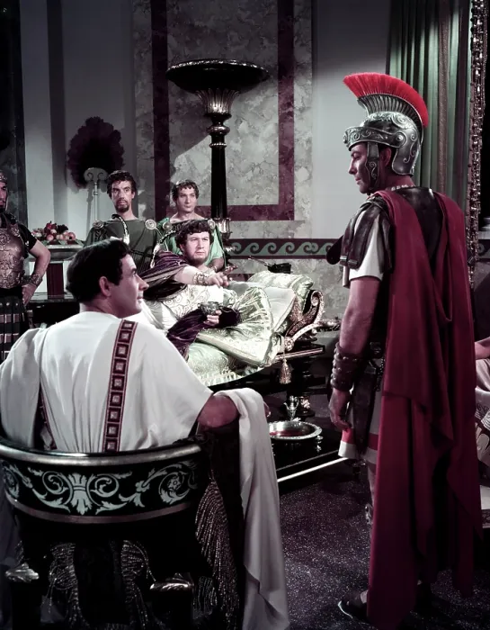 Framed Print : QUO VADIS, Leo Genn (back to camera), Peter Ustinov as Nero (reclining), Robert Taylor (right), 1951