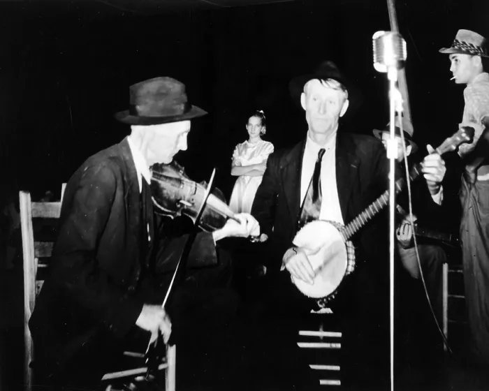 Framed Print : R. J. Boyd, playing fiddle, and Millard Garrett, playing banjo, both from Sandy Mush, North Carolina, at the the Mountain Music Festival, Asheville, North Carolina, 1938-1950
