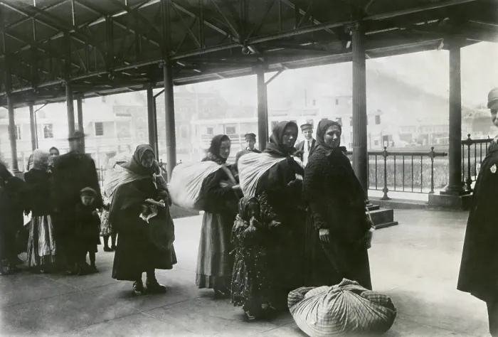Framed Print : After receiving their admission papers, European immigrants line up leave Ellis Island, 1900