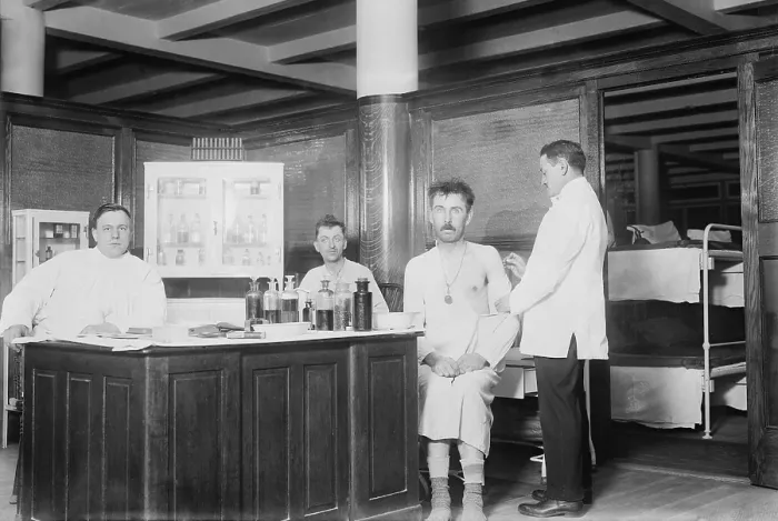 Framed Print : Two recently bathed men are given vaccinations by the doctor at New York City's Municipal Lodging House. Ca. 1910 Framed Print : Two recently bathed men are given vaccinations by the doctor at New York City's Municipal Lodging House. Ca. 1910