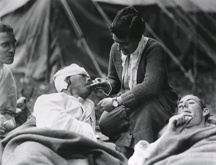 Framed Print : Red Cross Worker Miss Anna Rochester, of the Smith College Unit, helping a wounded soldier with his cigarette at the U.S Framed Print : Red Cross Worker Miss Anna Rochester, of the Smith College Unit, helping a wounded soldier with his cigarette at the U.S