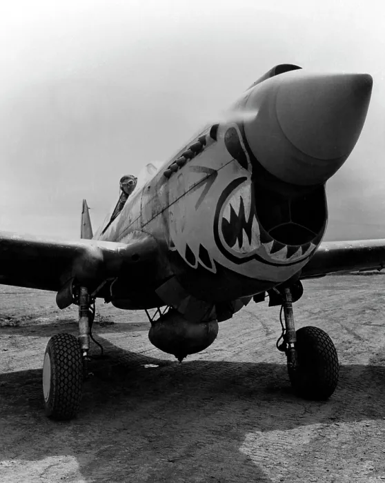 Framed Print : One of the redoutable 'Flying Tigers' ready to take off from an Alaskan point in a Curtis P-40 'Warhawk' fighter plane. ca. 1940-1946