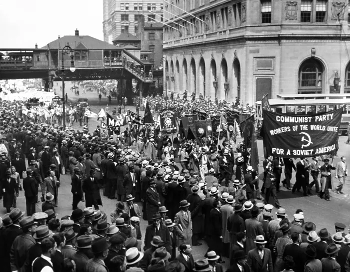 Framed Print : Reds gather for 1934 May Day parade to Union Square in New York City. The procession is lead by a large banner reading, Communist Party. Workers of the World Unite