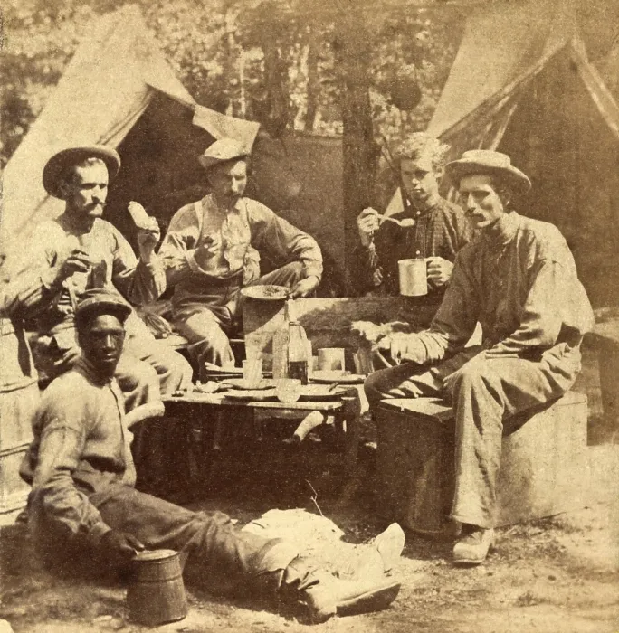 Framed Print : Relaxed scene of soldiers from the Army of the Potomac eat their meal in the company of an African American Framed Print : Relaxed scene of soldiers from the Army of the Potomac eat their meal in the company of an African American
