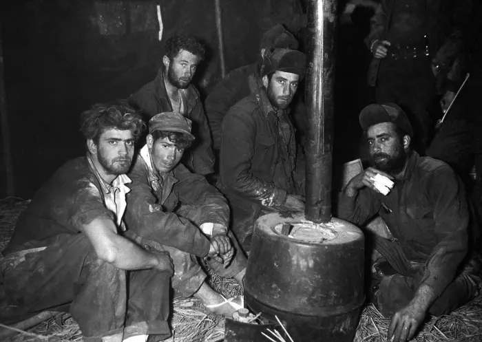 Framed Print : Released American and Australian POWs warming up by a stove. They are in the 24th Division medical clearing station after being returned to U.S Framed Print : Released American and Australian POWs warming up by a stove. They are in the 24th Division medical clearing station after being returned to U.S
