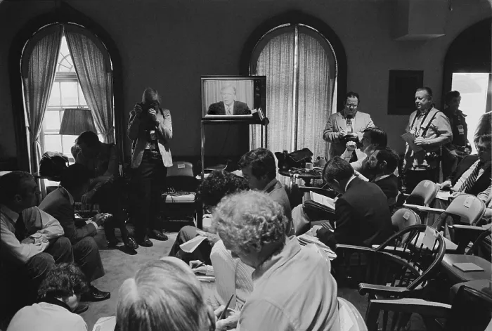 Framed Print : Reporters watch President Carter's television announcement of the aborted Iran Hostages rescue attempt