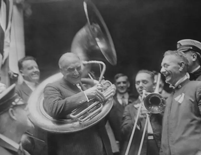 Framed Print : Republican Presidential nominee Warren Harding encircled by a sousaphone. August 1920. This created an amusing image for his front porch campaign in 1920