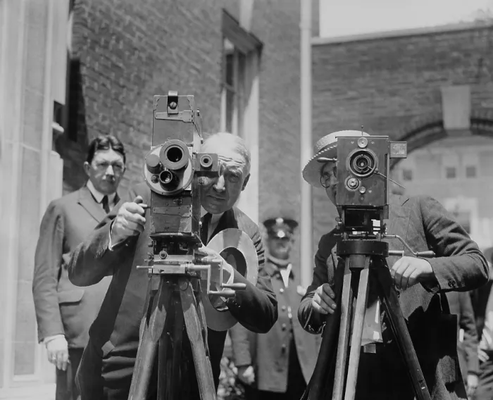 Framed Print : Republican Presidential nominee Warren Harding operating a newsreel camera. At right is a photojournalist at the Senator Harding's Washington home. Ca. June 1920 Framed Print : Republican Presidential nominee Warren Harding operating a newsreel camera. At right is a photojournalist at the Senator Harding's Washington home. Ca. June 1920