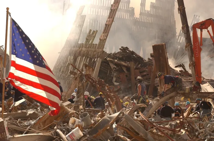 Framed Print : Rescue workers climb over and dig through piles of rubble from the destroyed World Trade Center as the American flag billows over the debris. Sept. 19 2001 Framed Print : Rescue workers climb over and dig through piles of rubble from the destroyed World Trade Center as the American flag billows over the debris. Sept. 19 2001