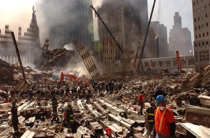 Framed Print : Rescue workers and firefighters in the wreckage at the World Trade Center two days after the 9-11 terrorist attacks on Spt. 13 2001. View toward the Southwest area of WTC site
