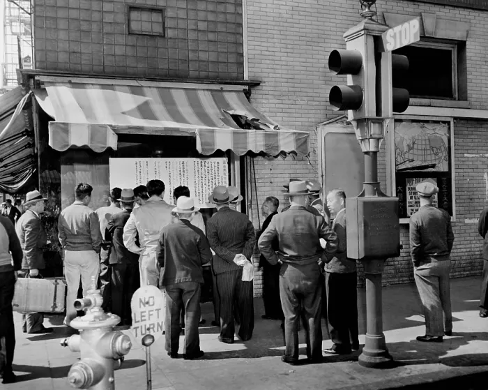 Framed Print : Residents of Little Tokyo in Los Angeles reading notices instructing them to evacuate. April 1942. World War 2. (BSLOC_2014_10_248)