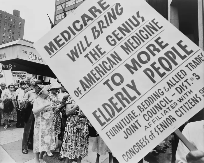 Framed Print : Retired senior citizens carrying pro-Medicare signs, picket outside the Hotel Americana during the American Medical Association's 114th annual convention in 1965 Framed Print : Retired senior citizens carrying pro-Medicare signs, picket outside the Hotel Americana during the American Medical Association's 114th annual convention in 1965