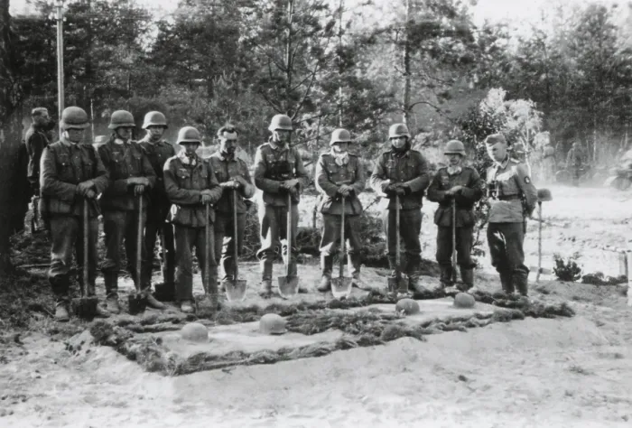 Framed Print : Reverent German soldiers stand with shovels at the grave of the commanding officer