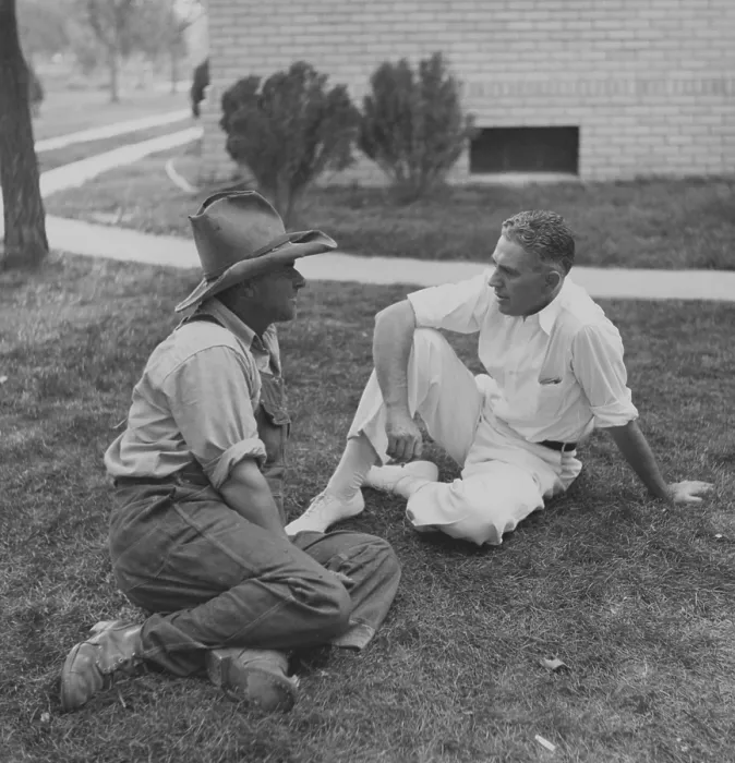 Framed Print : Rex Tugwell (1891-1979), confers with farmer on lawn of the courthouse in Springfield, Colorado in 1936