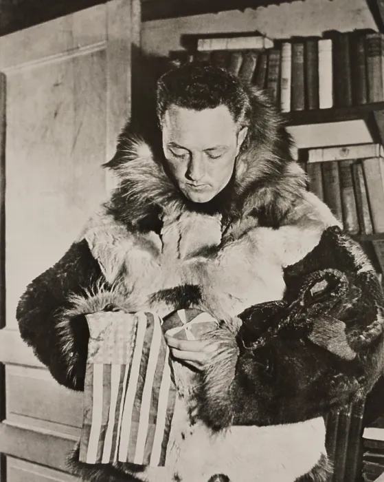 Framed Print : Richard Byrd in polar furs before his flight over the South Pole. He holds a small American flag weighted with a stone from the grave of his colleague and friend, Floyd Bennett
