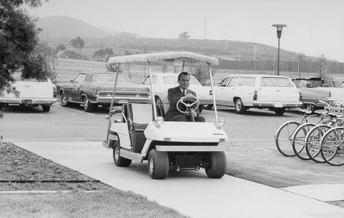 Framed Print : Richard Nixon driving a golf cart in a sidewalk to the helipad at San Clemente. Ca. 1969-74 Framed Print : Richard Nixon driving a golf cart in a sidewalk to the helipad at San Clemente. Ca. 1969-74
