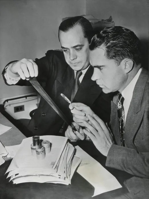 Framed Print : Richard Nixon examines the Pumpkin Paper microfilms with Robert Stripling, HUAC Chief Investigator. The film contained 64 U.S