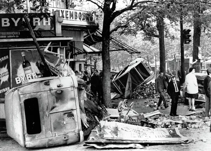 Framed Print : RIOTS-Parisians inspect overturned auto and other debris in the Edmond Rostand Square after riot. 5 / 25 / 98. Courtesy: CSU Archives  /  Everett Collection