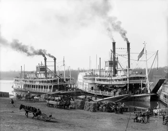 Framed Print : Riverboats on the Mississippi River receiving cargo and supplies at the Vicksburg landing. African Americans provide the hard labor of loading the boats. Ca. 1905