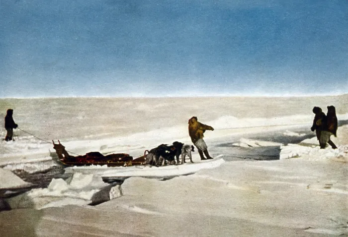 Framed Print : Robert Peary's successful North Pole Expedition traveling over frozen polar landscape. Men and dog sled are crossing water on an ice floe, 1909