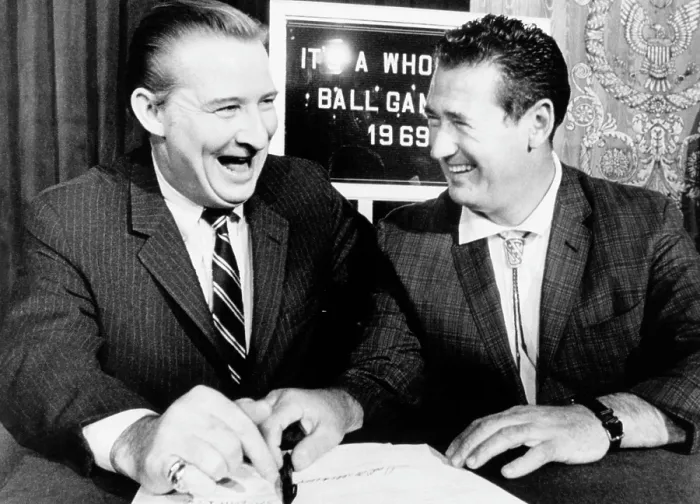 Framed Print : Robert Short, owner of the Washington Senators laughs as he signs Ted Williams to a five-year contract as manager and part owner. Feb 21, 1969 Framed Print : Robert Short, owner of the Washington Senators laughs as he signs Ted Williams to a five-year contract as manager and part owner. Feb 21, 1969