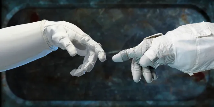 Framed Print : Robonaut hand (left), and a spacesuit-gloved human-hand. Called the Human Grasp Assist Device, it is the first humanoid robot in space