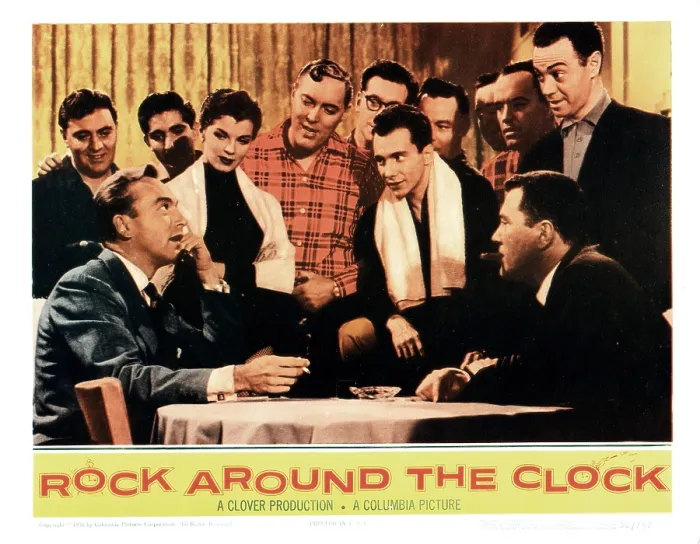 Framed Print : ROCK AROUND THE CLOCK, (seated): Johnnie Johnston (l), John Archer (r), (Standing): Lisa Archer, Bill Haley (plaid shirt), The Comets, Freddie Bell (white scarf), Alan Freed, 1956