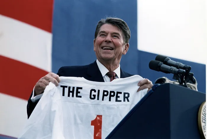Framed Print : Ronald Reagan. President Reagan holding a Gipper jersey at a Reagan-Bush Rally in New York, 1984