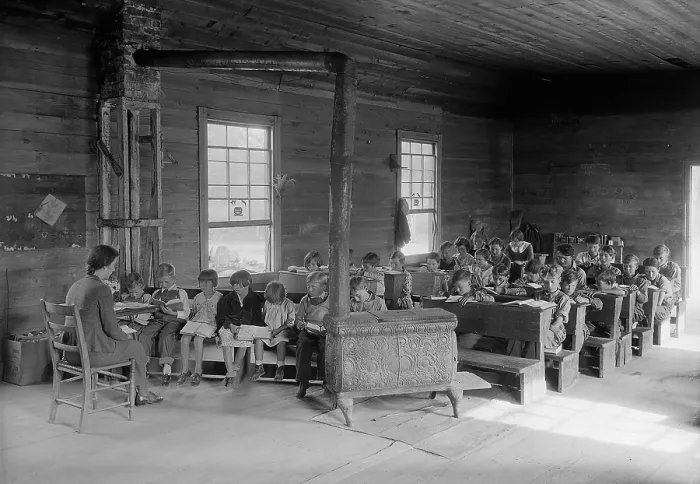 Framed Print : One room school with 28 students of various ages. Bare room lacks educational equipment and is heated by a wood stove. Oakdale School near Loyston, Tennessee. Oct. 1930