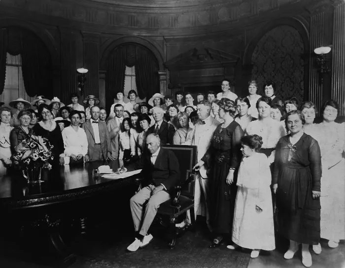 Framed Print : A room full women and a few men witness Governor Frederick Gardner signing Missouri's ratification of the 19th Amendment