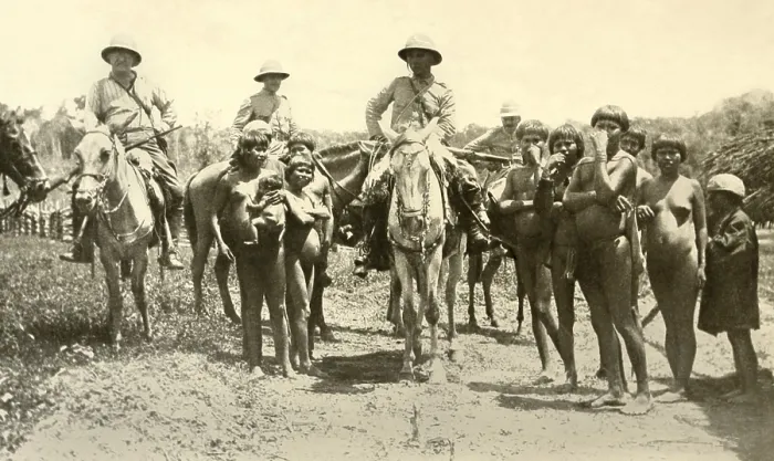Framed Print : Roosevelt-Rondon Expedition encounters friendly Nhambiquara Indians on the plateau. Colonel Candido Rondon, at center, was the first director of Brazils Indian Protection Bureau Framed Print : Roosevelt-Rondon Expedition encounters friendly Nhambiquara Indians on the plateau. Colonel Candido Rondon, at center, was the first director of Brazils Indian Protection Bureau