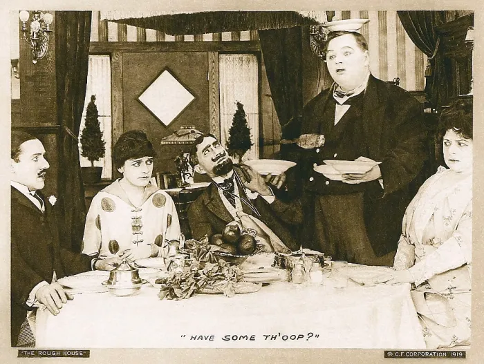 Framed Print : THE ROUGH HOUSE, second from left: Alice Lake; second from right: Roscoe Fatty Arbuckle; far right: Agnes Neilson in a scene card dated 1919, 1917 Framed Print : THE ROUGH HOUSE, second from left: Alice Lake; second from right: Roscoe Fatty Arbuckle; far right: Agnes Neilson in a scene card dated 1919, 1917