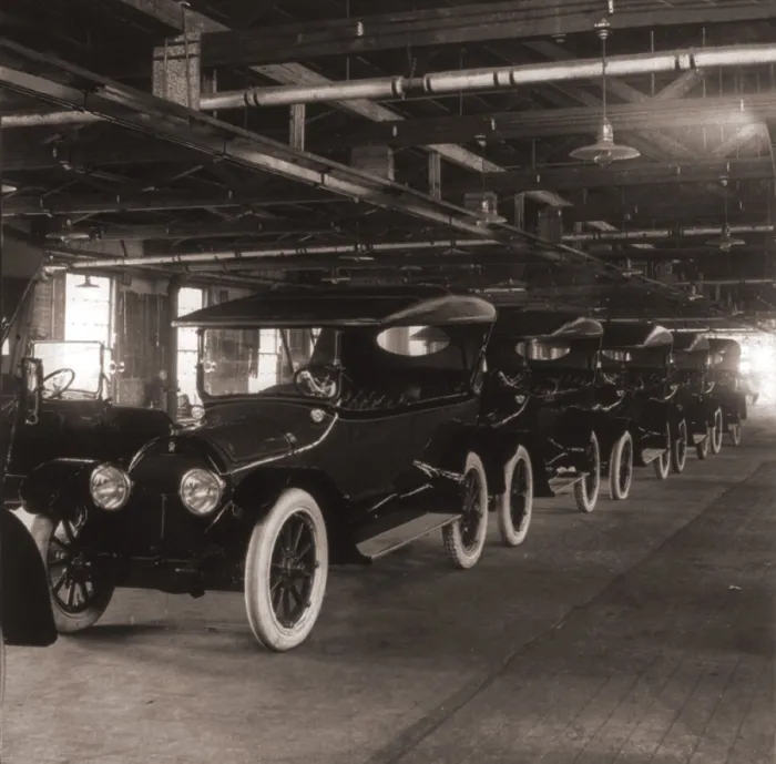 Framed Print : Row of Cadillac touring cars come off the assembly line in 1917. Cadillac was purchased by General Motors in 1909, and became its luxury line
