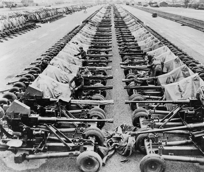 Framed Print : Rows of 40mm Bofors light anti-aircraft guns beside railroad tracks in England Framed Print : Rows of 40mm Bofors light anti-aircraft guns beside railroad tracks in England