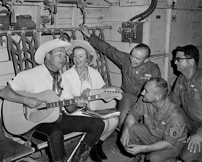 Framed Print : Roy Rogers and Dale Evans entertain troops in Vietnam. They sing for the crew of an Air Force C-123 transport while on a USO tour. Nov. 11, 1966